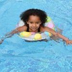 child having some fun in a swimming pool